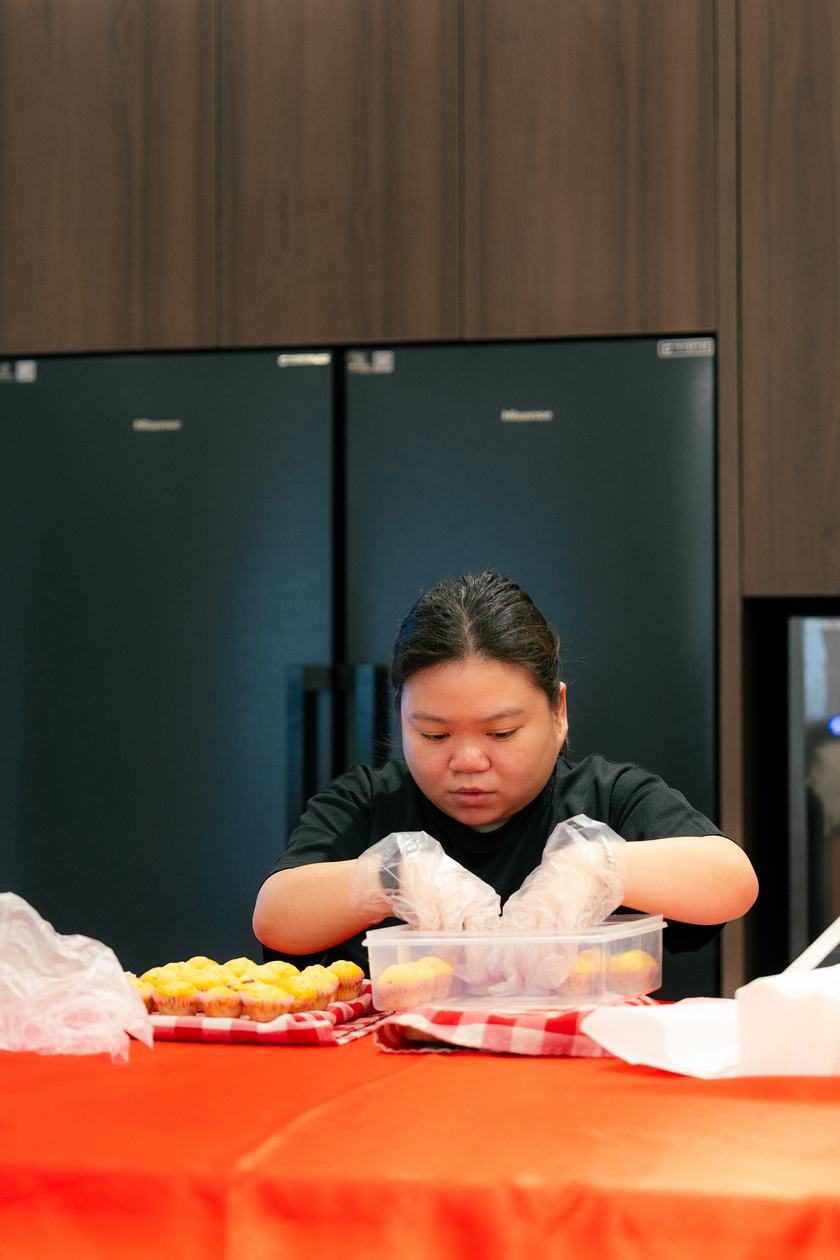 A youth preparing muffins